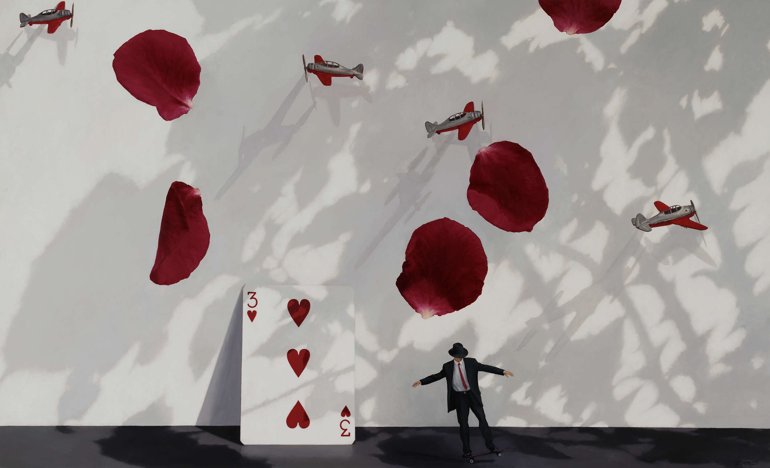 white wall with shadows, giant red rose petals falling, tiny silver and red airplanes flying, giant playing card (3 of Hearts) with shadows, diminutive male figure wearing suit and fedora hat skateboarding