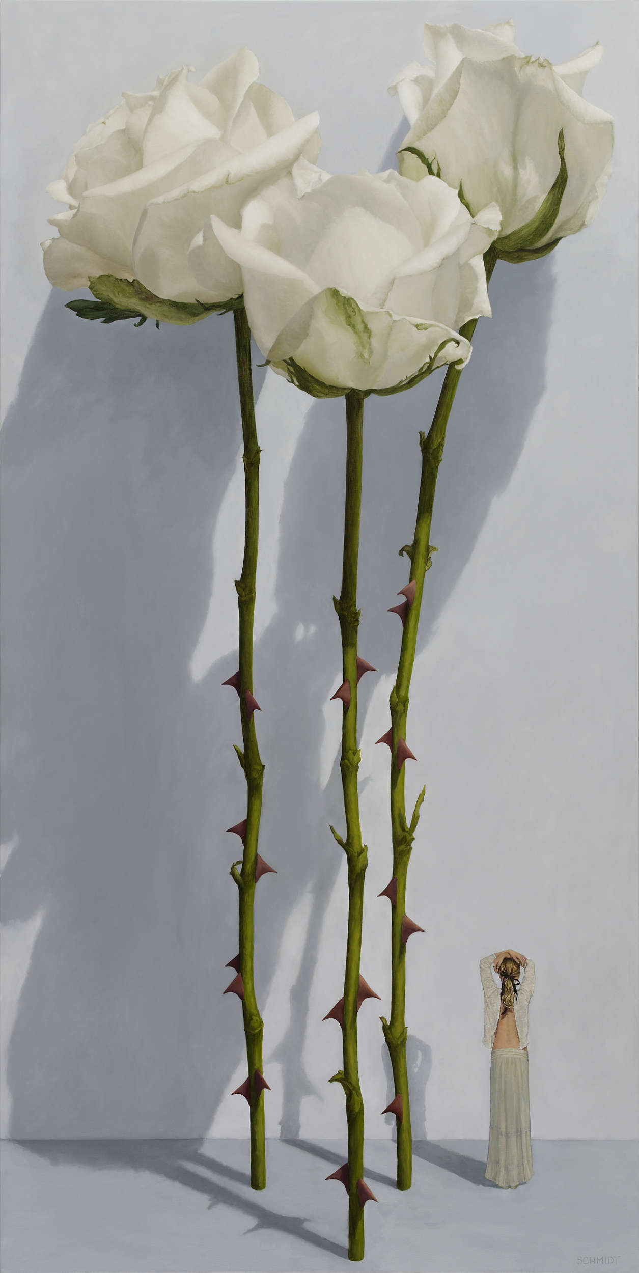 3 white roses standing and still closed, light gray wall with shadows, stems and thorns, diminutive female figure (Sophie) with arms up, dressed in white