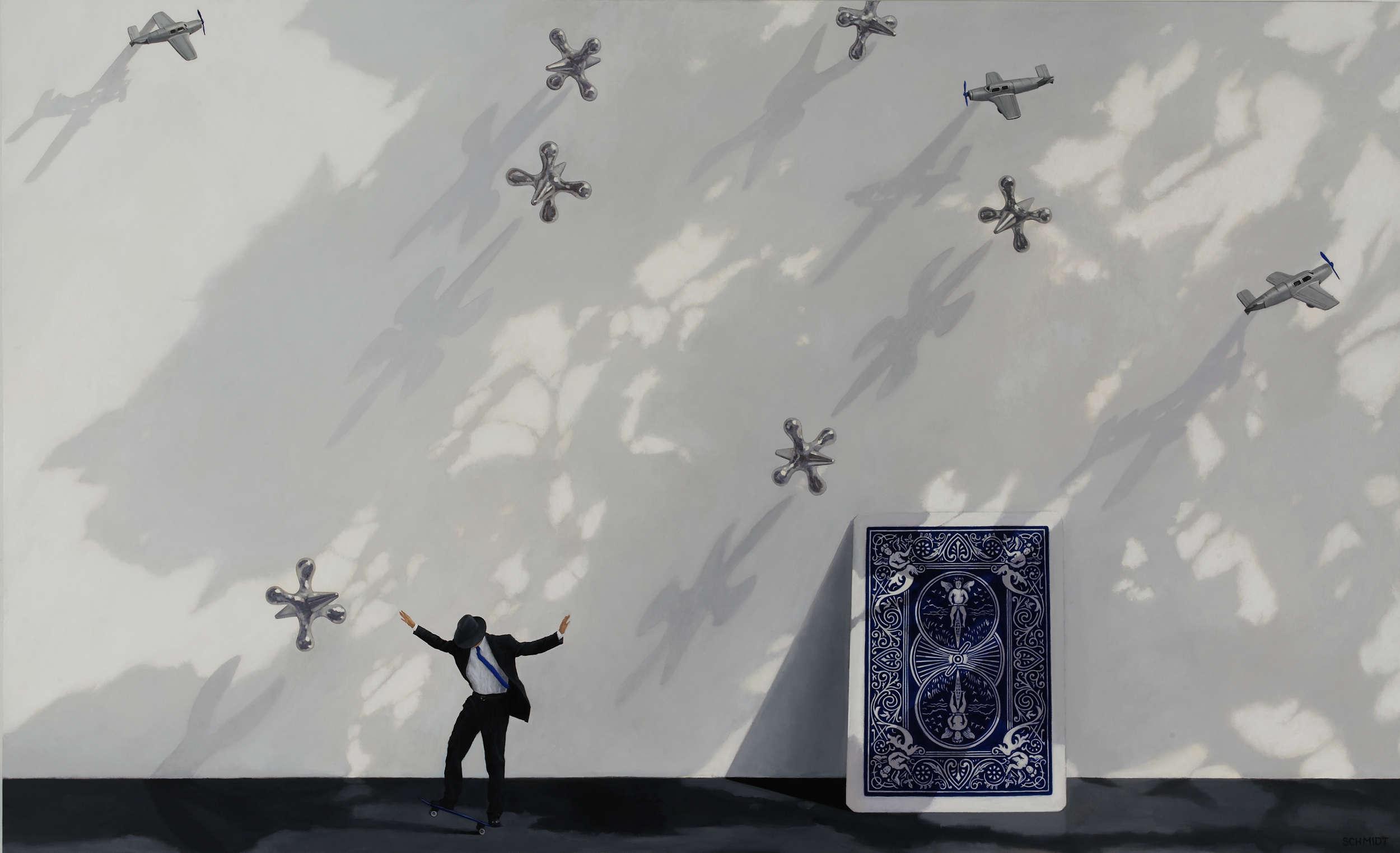 Shadows on white wall, floral side of giant playing card, diminutive male figure wearing suit and fedora hat and skateboarding (Michael Philip) giant silver jacks falling from above and tiny silver airplanes flying