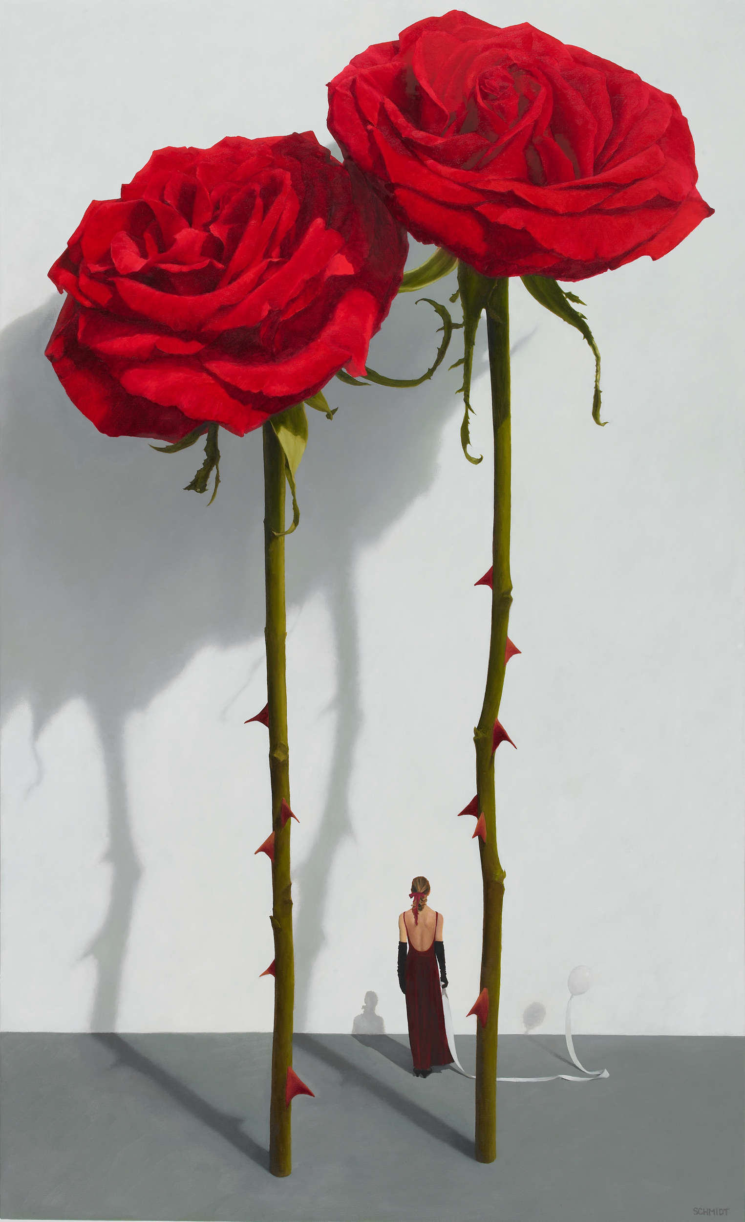 2 red roses standing, stems and thorns, white wall with shadows, diminutive female figure facing wall (Samantha) with a balloon