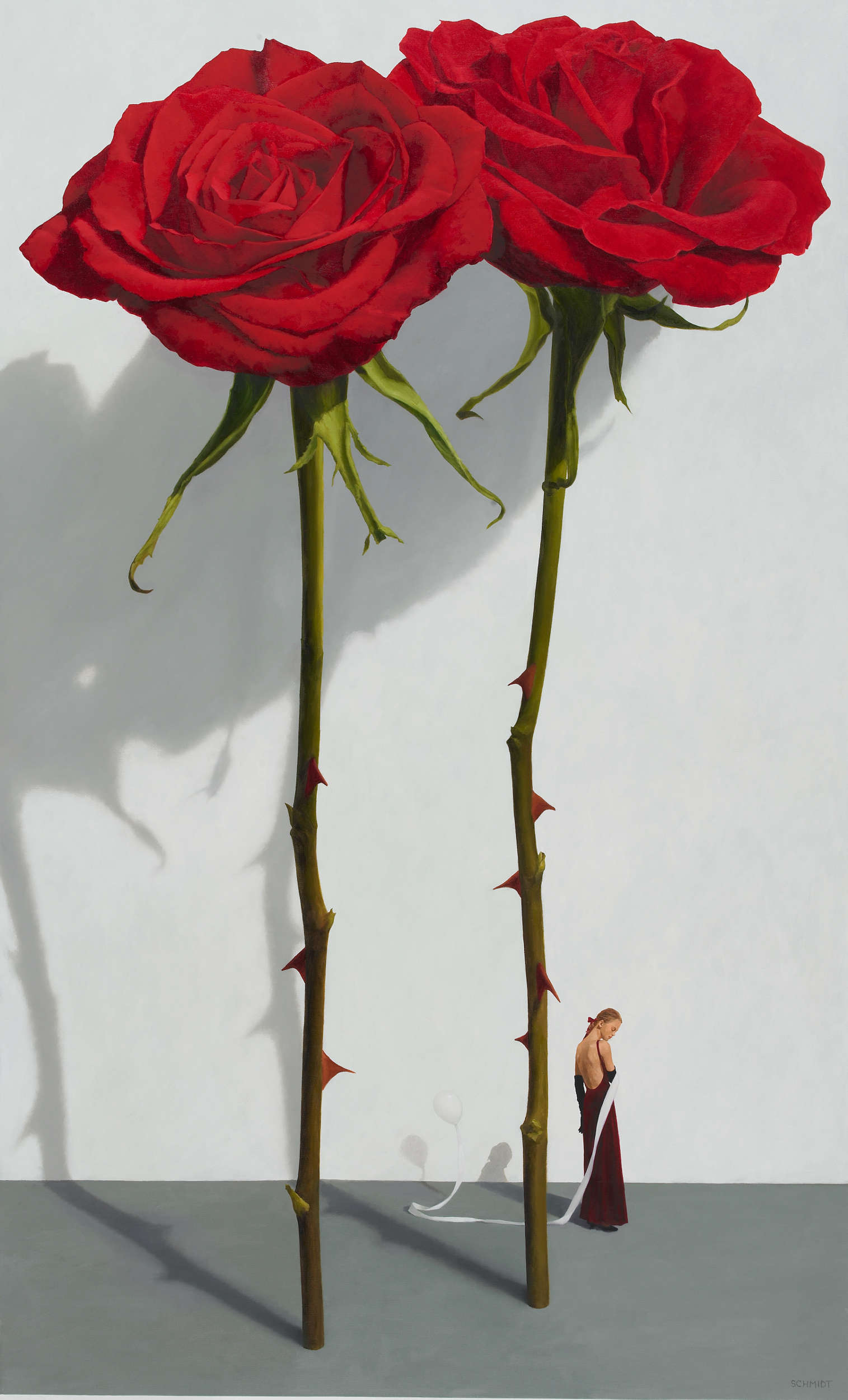 2 red roses standing, stems and thorns, white wall with shadows, diminutive figure facing sideways (Samantha) with a balloon