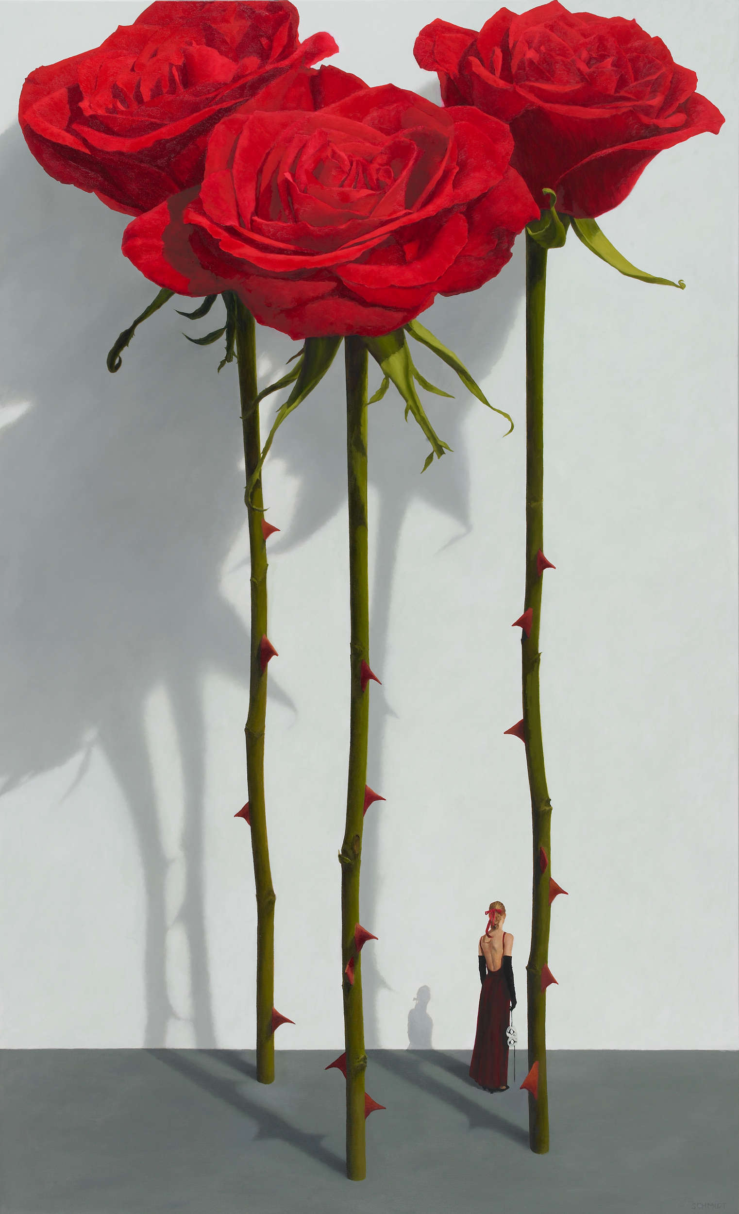 3 red roses standing, stems and thorns, white wall with shadows, diminutive female figure holding theatrical mask (Samantha)