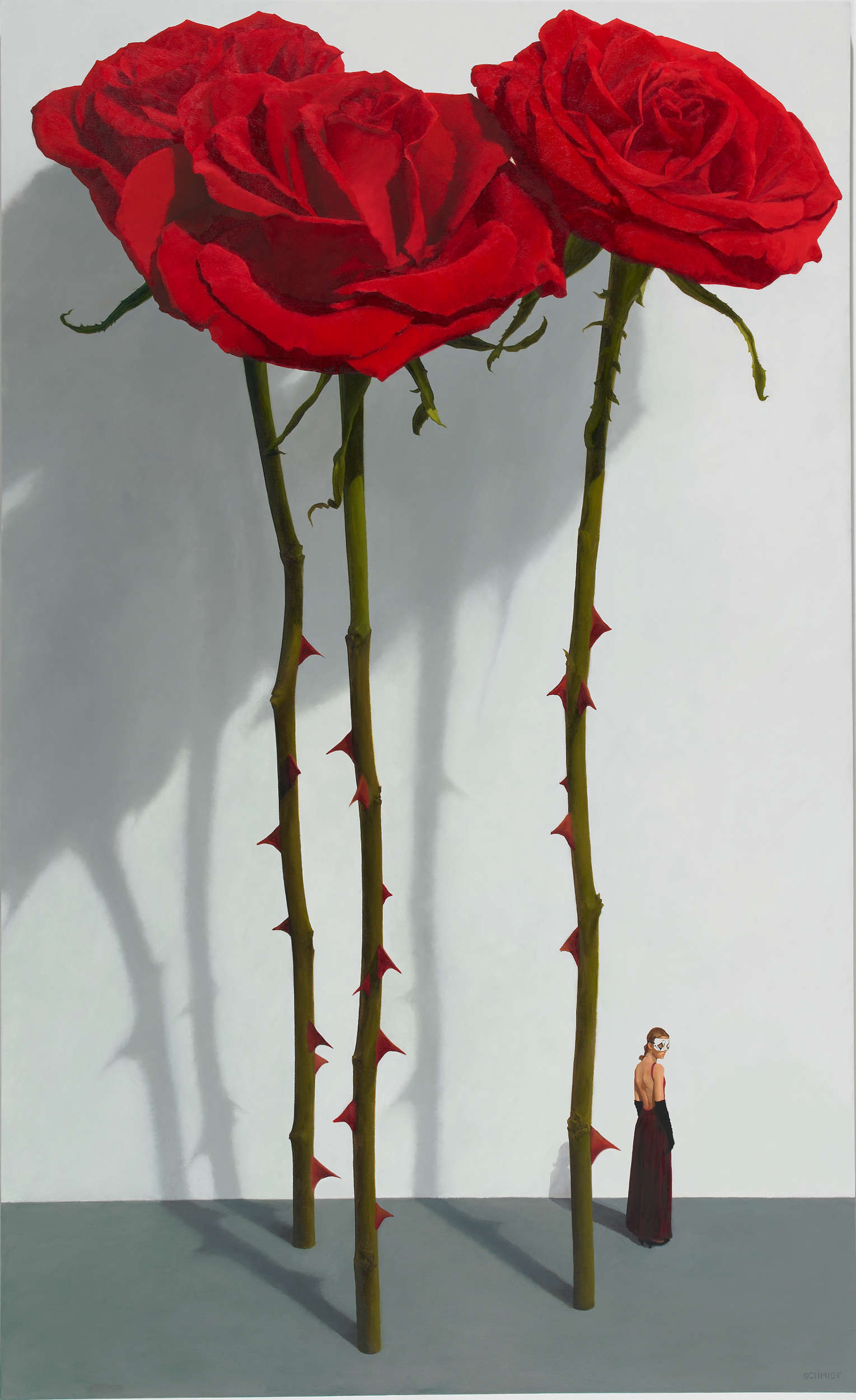 3 red roses standing, stems and thorns, white wall with shadows, diminutive female figure wearing theatrical mask (Samantha)