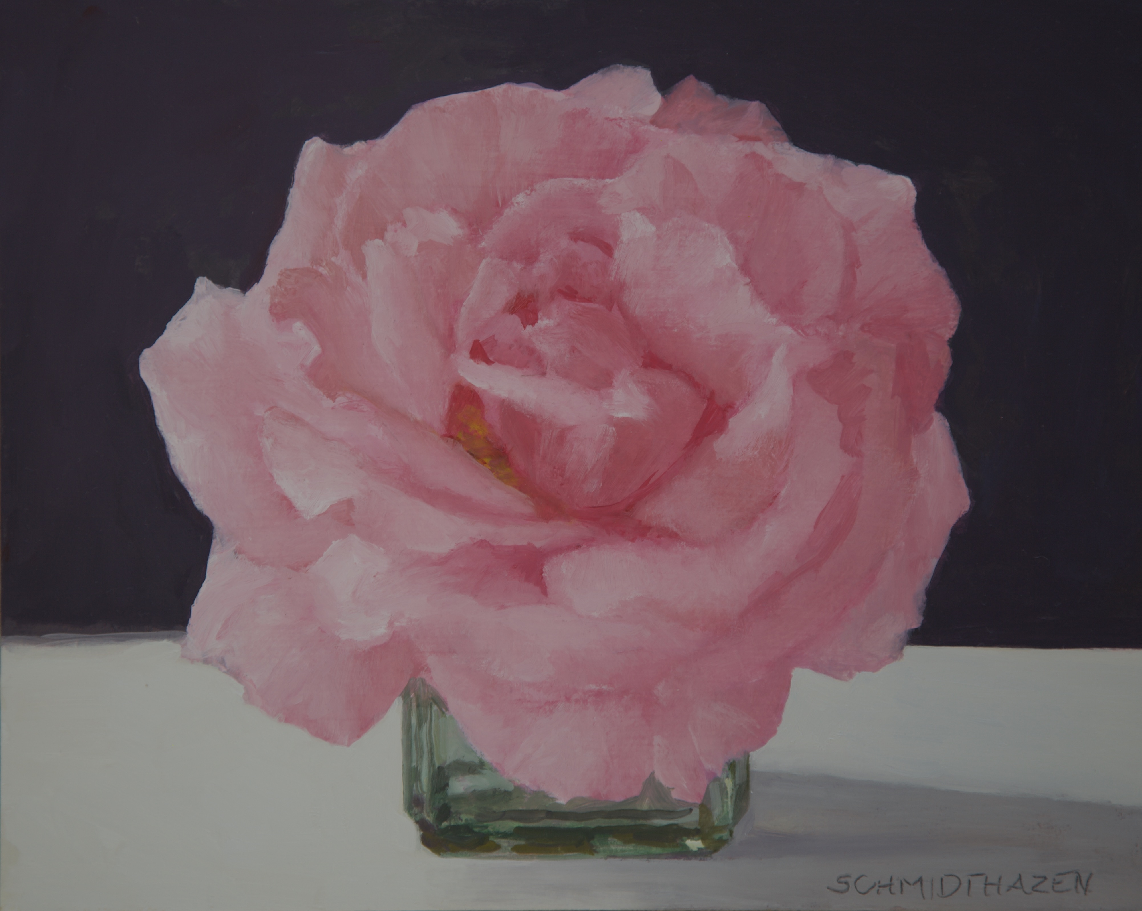 pink rose in glass bottle