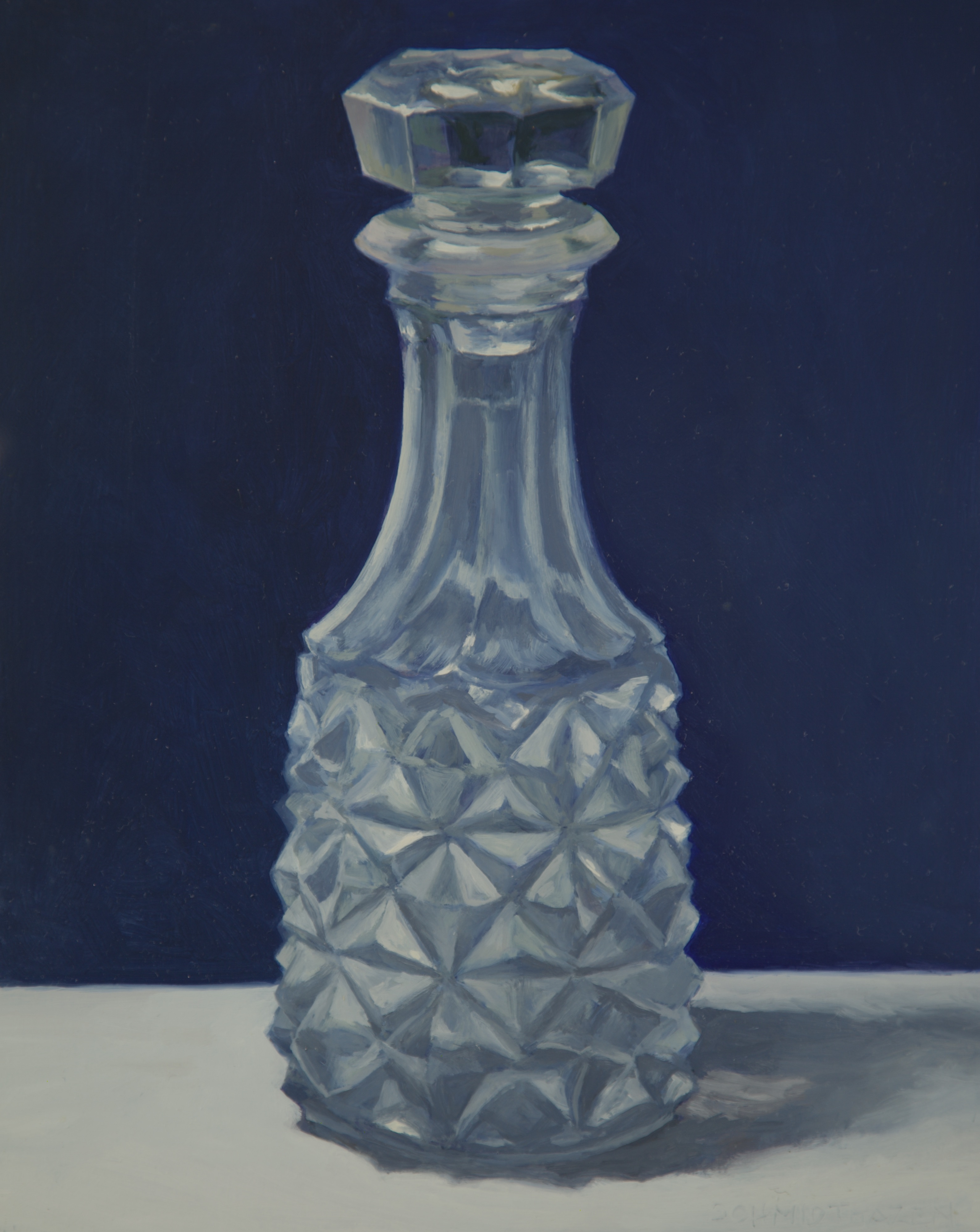 glass perfume bottle with blue background