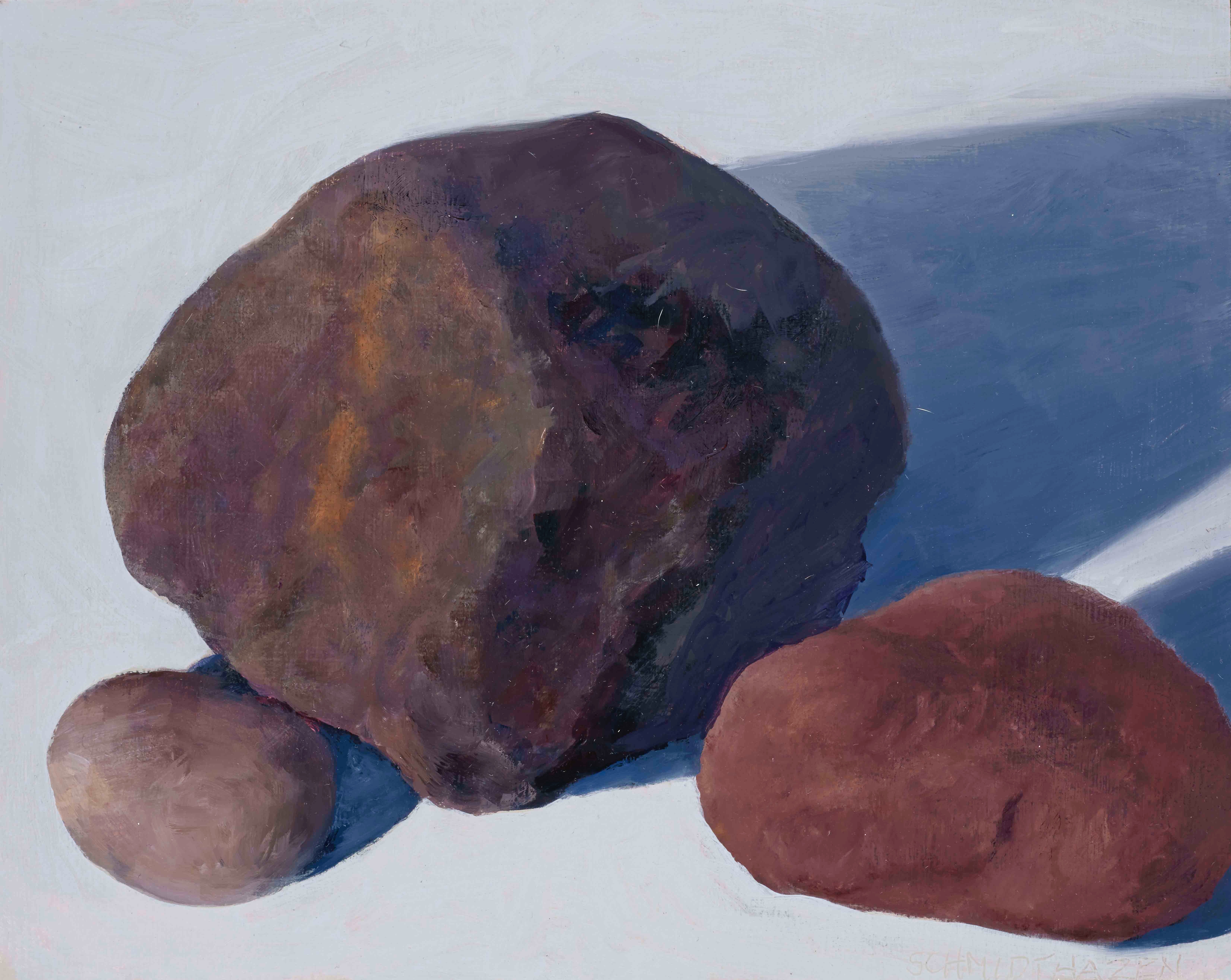 3 rocks different colors with shadows